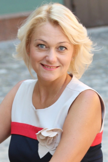 Ukrainian girl Svetlana,48 years old with blue eyes and blonde hair.